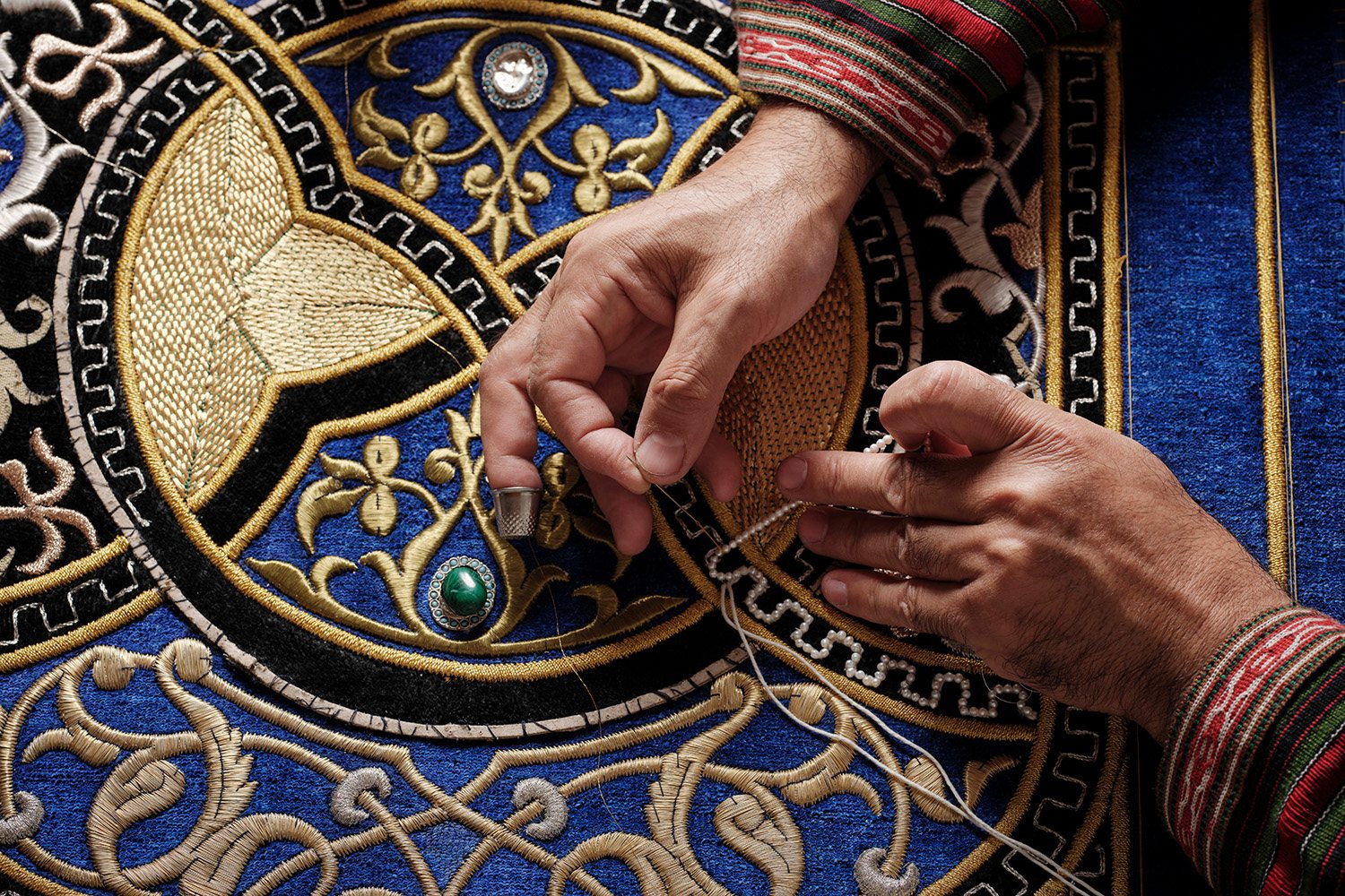 Gold thread on indigo velvet in the workshop of Nodir Rasulov, Bukhara